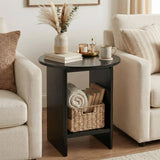 [Black] Small Round Side Table with Shelf Living Room positioned between two cream sofas with pampas vase on top and wicker basket with rolled throw on lower shelf