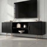[Black]   Black 140cm TV unit at three-quarter angle, fluted door fronts and open centre with mantel clock and bowl