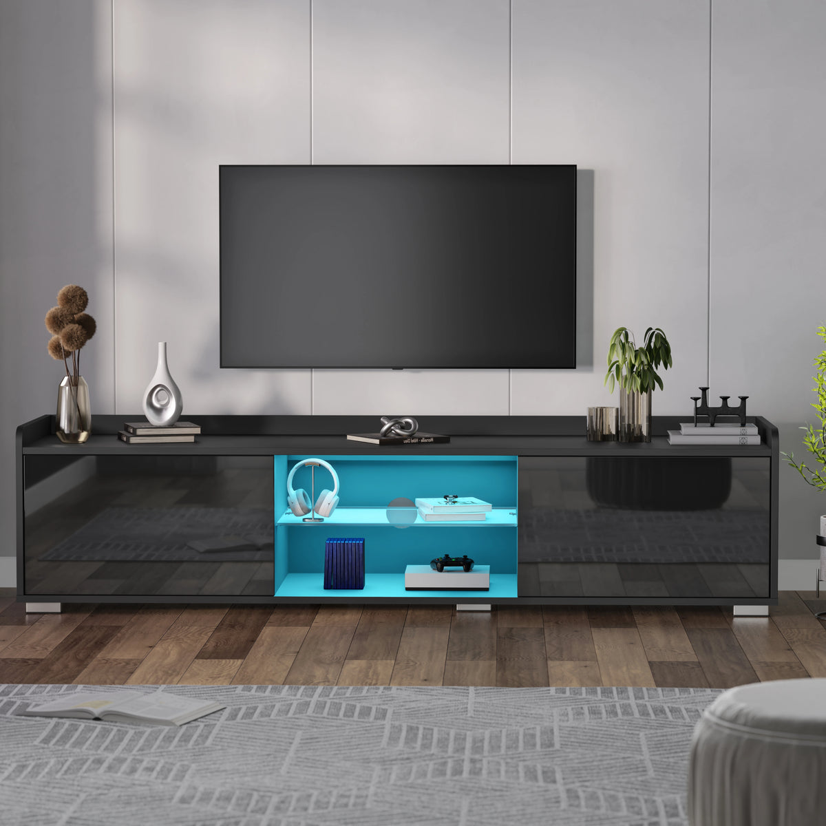 [Black] Front shot of black TV unit with blue interior LED, decor on top, beige flooring below