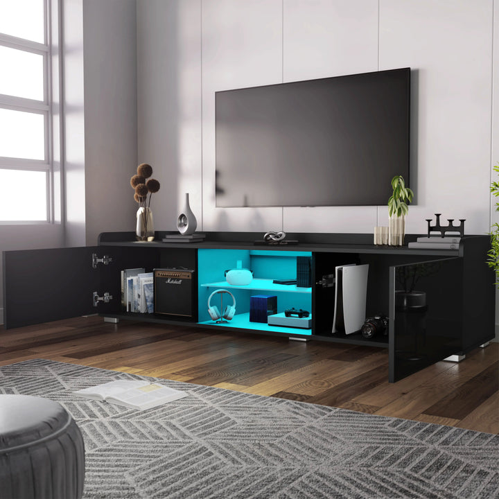 [Black] Angled view of black gloss TV unit, window left, TV mounted on grey wall, blue LED shelves