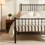 [Black | Single] Metal bed close-up of tall bar headboard with cream-white pillows, wooden bedside table, plant and wall art.