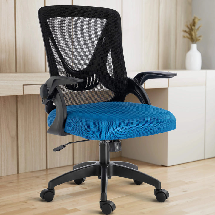 [Black+ Blue] The black and blue mesh chair is set in a home office, with the working desk behind it for ergonomic work comfort.
