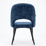 [Blue | Set of 2] Rear view of the comfy fabric dining chair with rounded open back, piped seat and four black metal legs.
