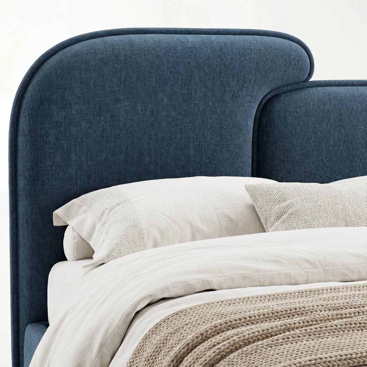 [King | Blue] Close view of blue upholstered split headboard surface showing fabric weave and softly curved outline