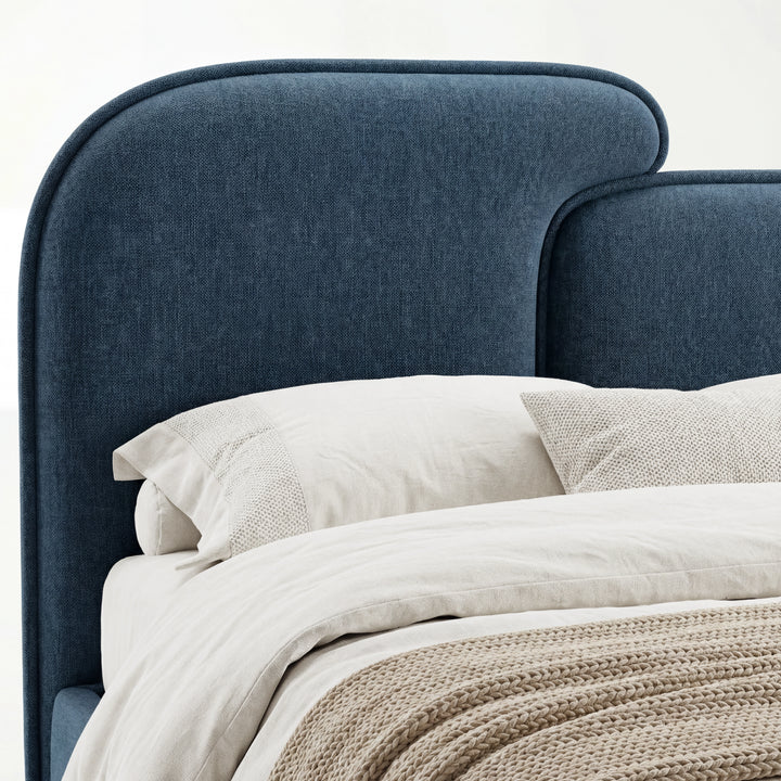 [King | Blue] Close view of blue upholstered split headboard surface showing fabric weave and softly curved outline