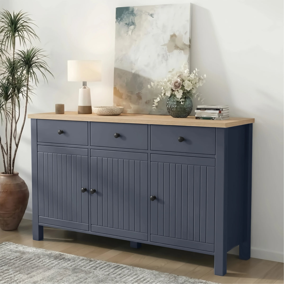 [Blue] 3 door sideboard with wooden top in a room setting with decor items