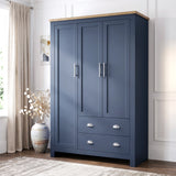 [Blue] Shaker triple wardrobe in navy blue with oak top, three panelled doors and two base drawers, angled view.