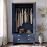[Blue] Wardrobe interior view with both doors open, hanging clothes, top shelf, lower drawers, handbag, and hat