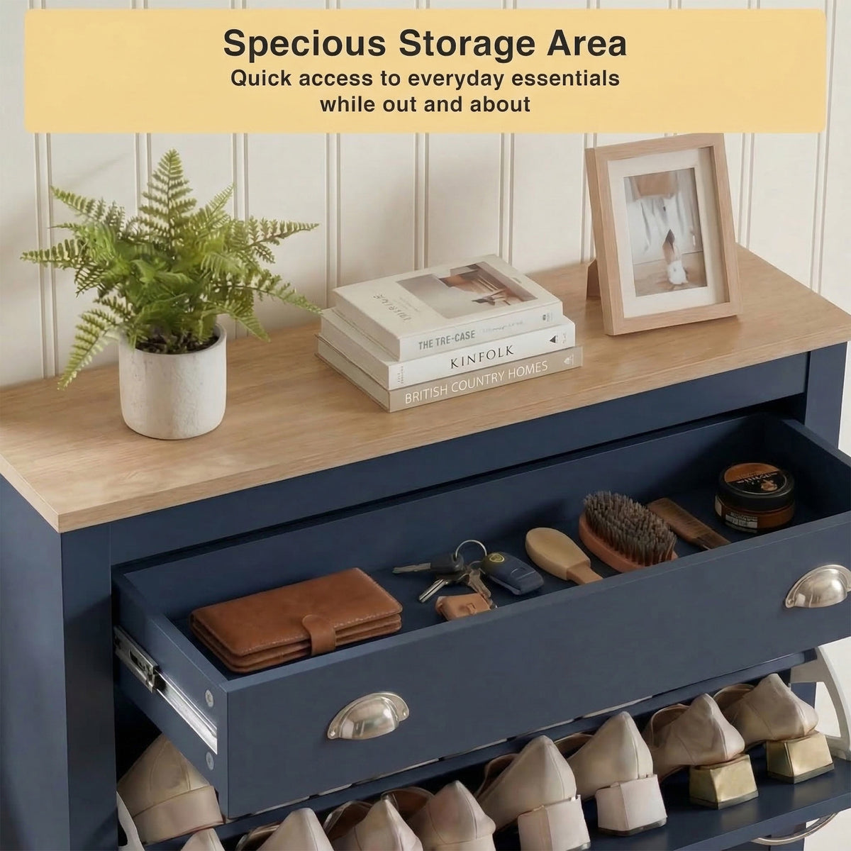 [Blue] Shoe Cabinet With Drawer top drawer pulled open showing keys, wallet, and shoe care accessories, with oak top styled with plants