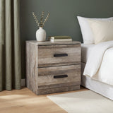 [Ash Grey] Blythe bedside table beside bed with vase of foliage and stacked books against green curtain