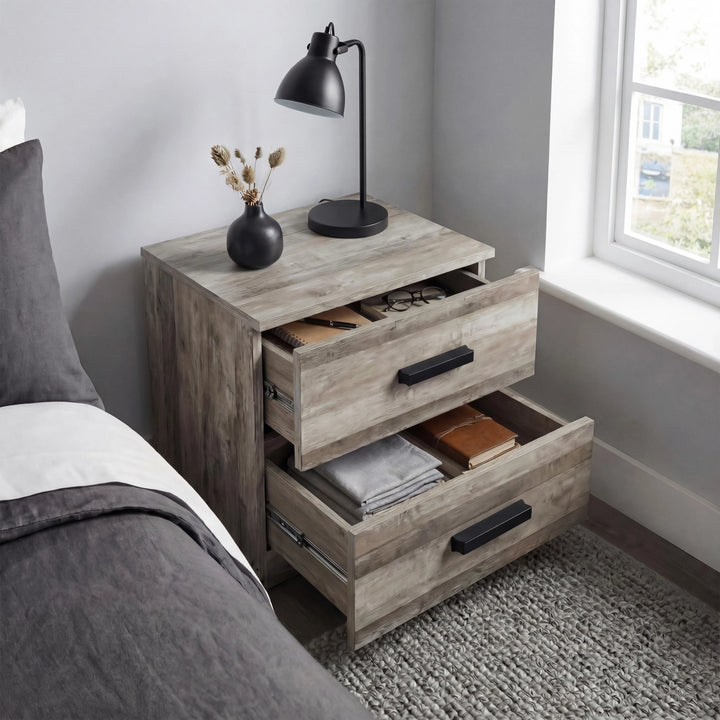 [Ash Grey] Blythe bedroom furniture set bedside with both drawers extended beside a grey upholstered bed