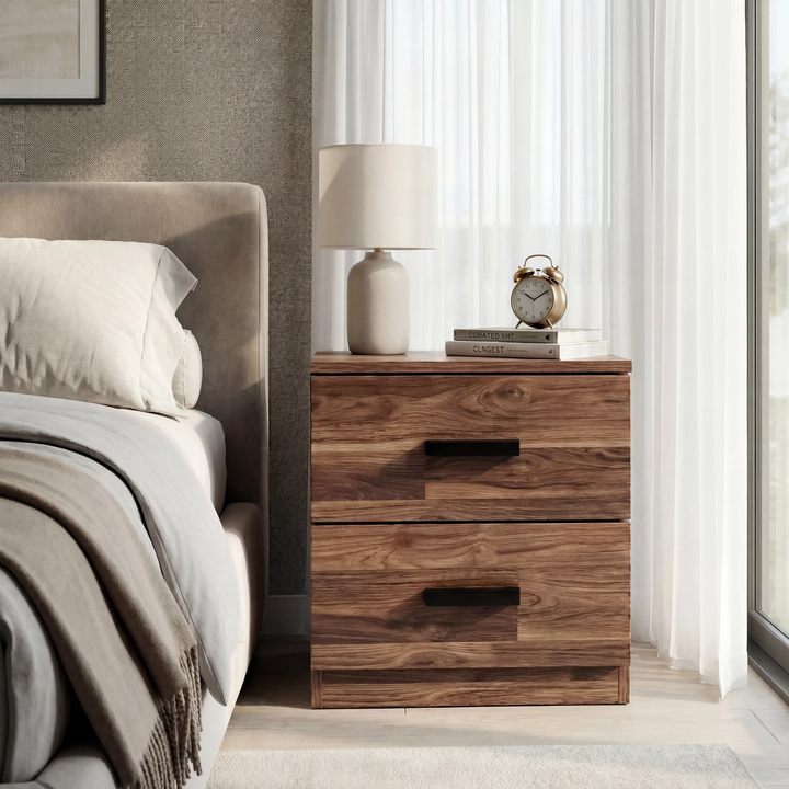 [Dark Bronx] 2 drawer bedside of the Blythe bedroom furniture set beside a cream bed with a lamp on top