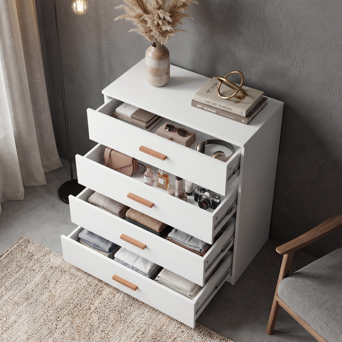 [White] 4 drawer chest of the Blythe bedroom furniture set with all drawers pulled out and items stored in each