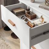 [White] Close-up of the Blythe bedroom furniture set chest drawer open with a notebook, pencil pot and accessories