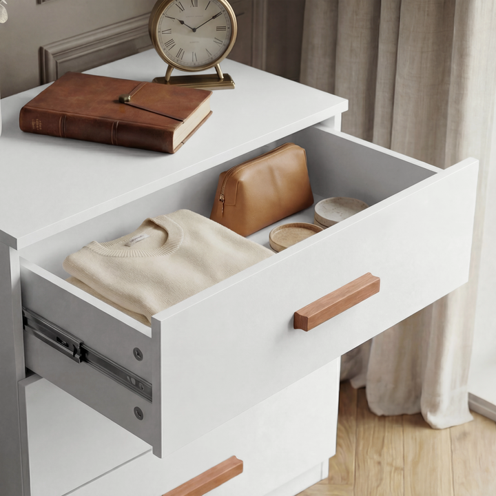 [White] Close view of the Blythe bedroom furniture set chest top drawer with warm wood handle pull centred