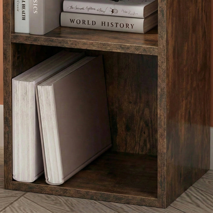 [2 Shelf | Rustic] compartment on dark rustic bedside-height cabinet, book stack and enamel jug with dried wheat