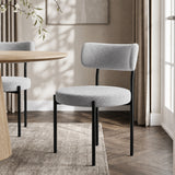 [Light Grey | Set of 4] Boucle dining chair beside a round table, showing curved back and slim black legs.