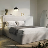 [Double | Grey] Grey boucle double ottoman bed angled, charcoal tasselled throw draped over foot of low storage base