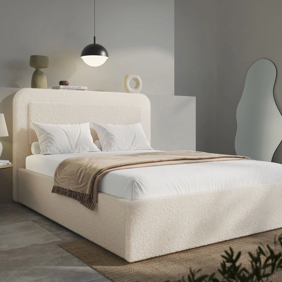 Wide angle of beige boucle king ottoman bed, gas-lift base with folded striped throw across foot