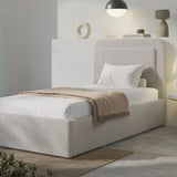 [Single | Grey] Single grey boucle ottoman bed front view, curved headboard and mid-grey duvet styled neatly