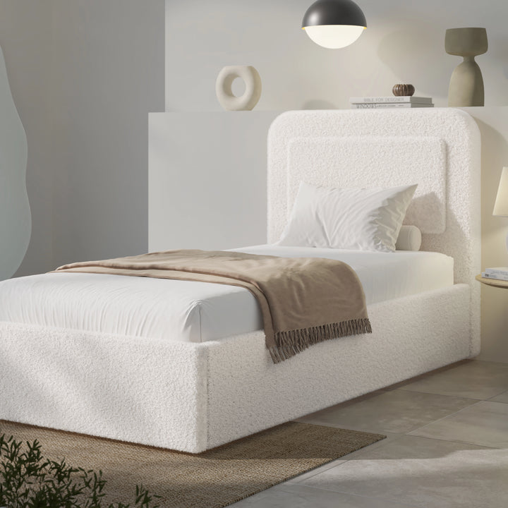 [Single | White] Single white boucle ottoman bed front view with curved headboard and crisp white duvet styled