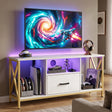 [White] Calvera 112cm white TV unit against a cream wall, wall-mounted TV above, amber LED in centre shelf