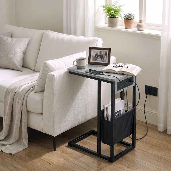[Concrete] sofa side table side view with concrete-effect top, socket panel, tea, power cable and storage pouch