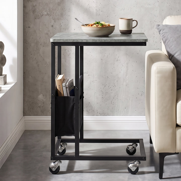 [Concrete] compact side table beside sofa with concrete-effect top, slim frame, pouch and caster wheels