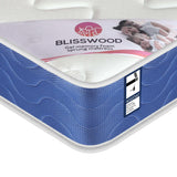 [White | Single] Sprung mattress corner with white quilted top, blue chevron side panel and pink Blisswood label.