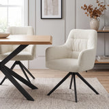 [Cream | Set of 2] Two swivel dining room chairs beside a pale wood table, featuring rounded arms and black metal base.