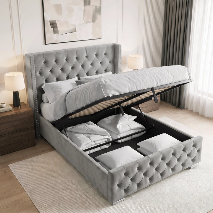 [Double | Light Grey] tufted velvet storage bed with the lift-up mattress platform open, showing folded bedding and pillows inside, set in a modern bedroom