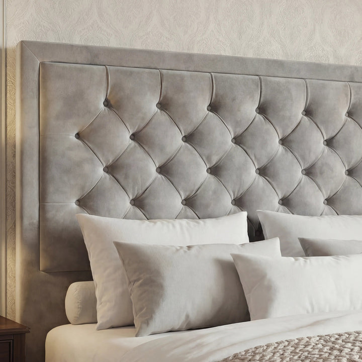 [Double | Light Grey] Close-up of deep chesterfield button-tufted headboard with puffed diamond velvet panels