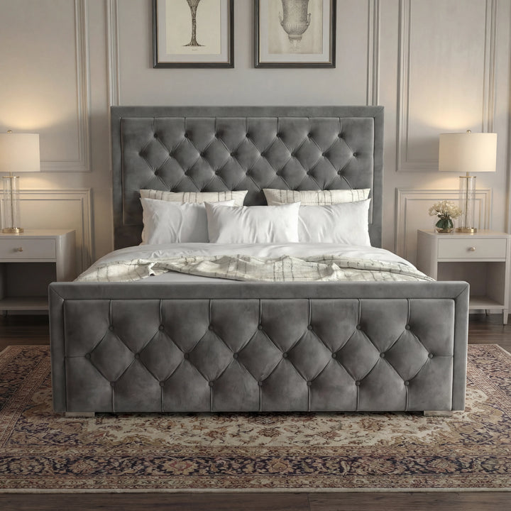 [King | Grey] Front view of cross-puffed ottoman bed centred between matching nightstands with crystal lamps