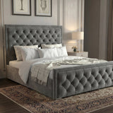 [King | Grey] Side angle of cross-puffed ottoman bed showing tufted headboard and footboard in styled room