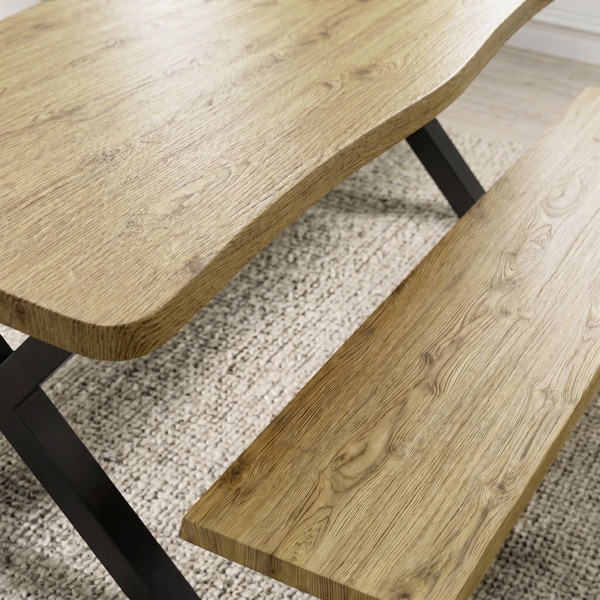 [Light Oak] Crosswick Industrial 6 Seater Dining Table with Benches close-up detailing the natural wood grain pattern and smooth curved edges of the tabletop and matching bench surface.