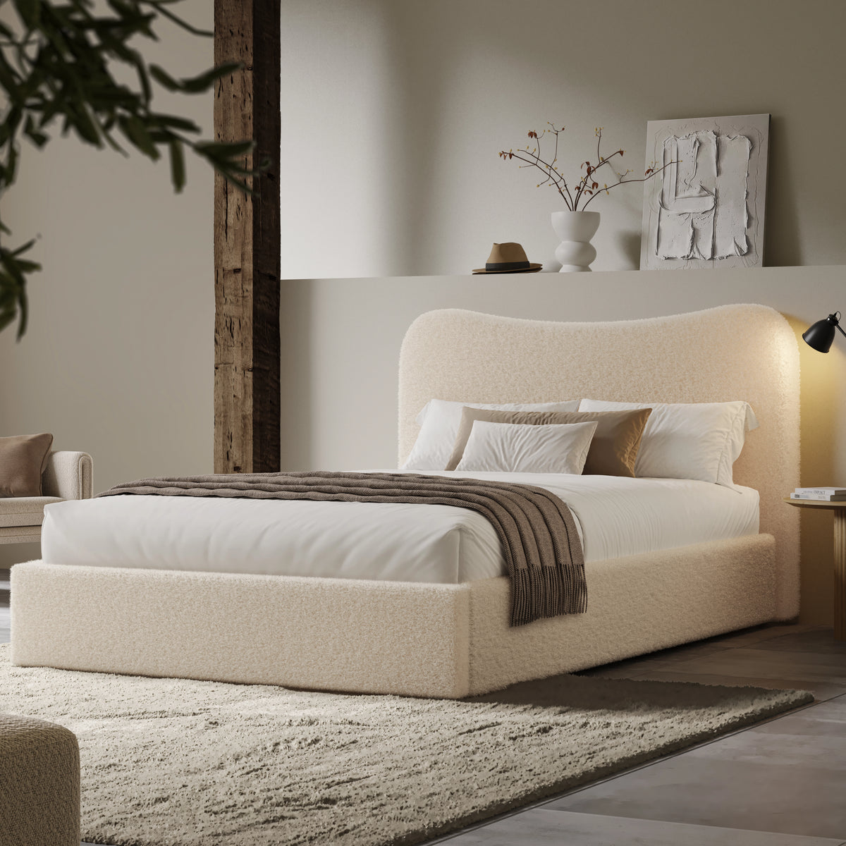 [Double | Beige] Wide angle of boucle ottoman bed in loft room with reclaimed timber beam and floating shelf with art