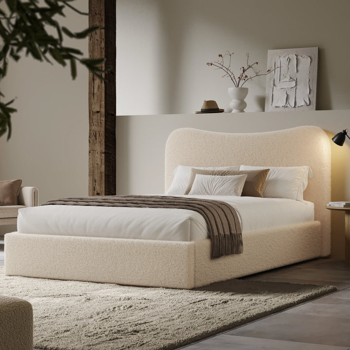[Double | Beige] Wide angle of boucle ottoman bed in loft room with reclaimed timber beam and floating shelf with art