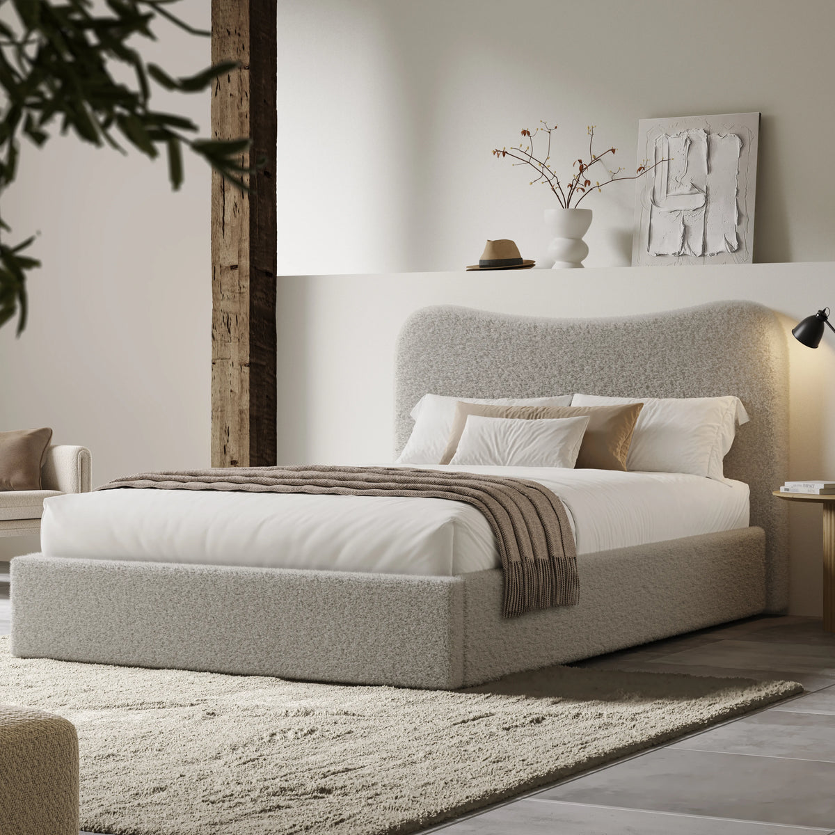 [Double | Grey] Wide angle of boucle ottoman bed in loft room with reclaimed timber beam and floating shelf with art