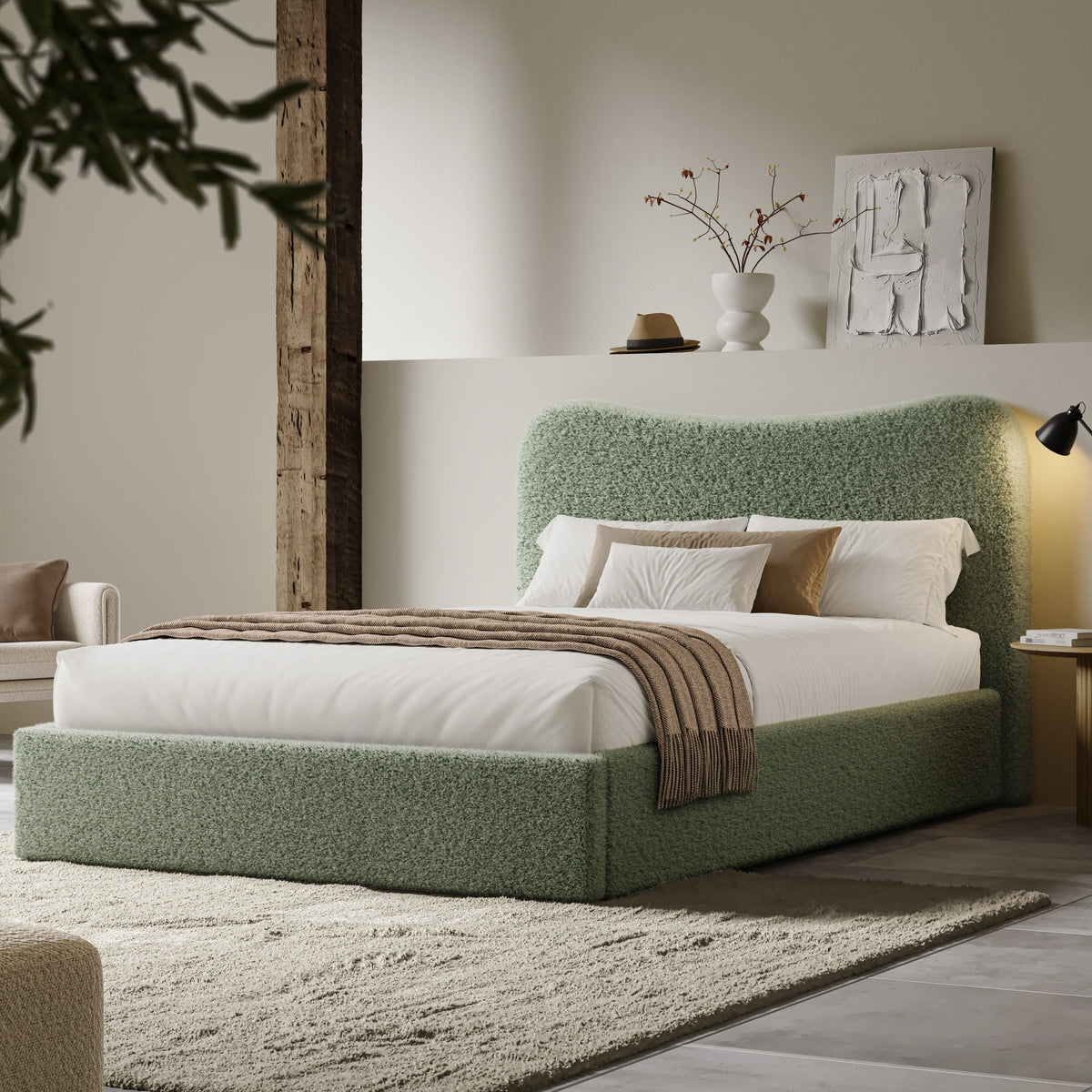 [Double | Sage Green] Wide angle of boucle ottoman bed in loft room with reclaimed timber beam and floating shelf with art