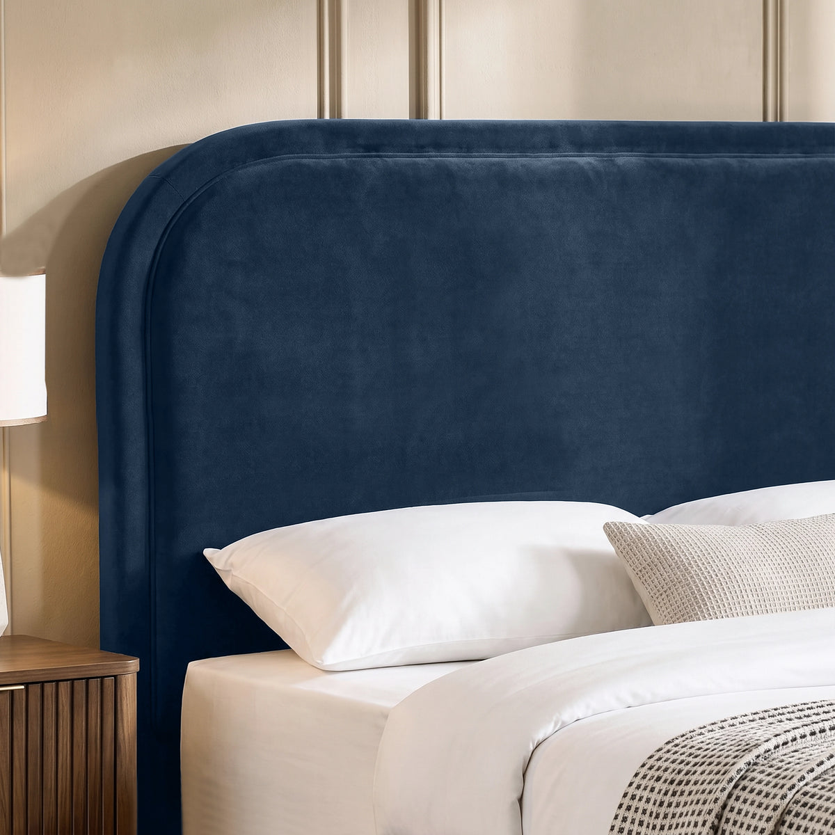 [Blue | Double] Close-up of plush padded curved headboard with raised border piping that keeps its shape