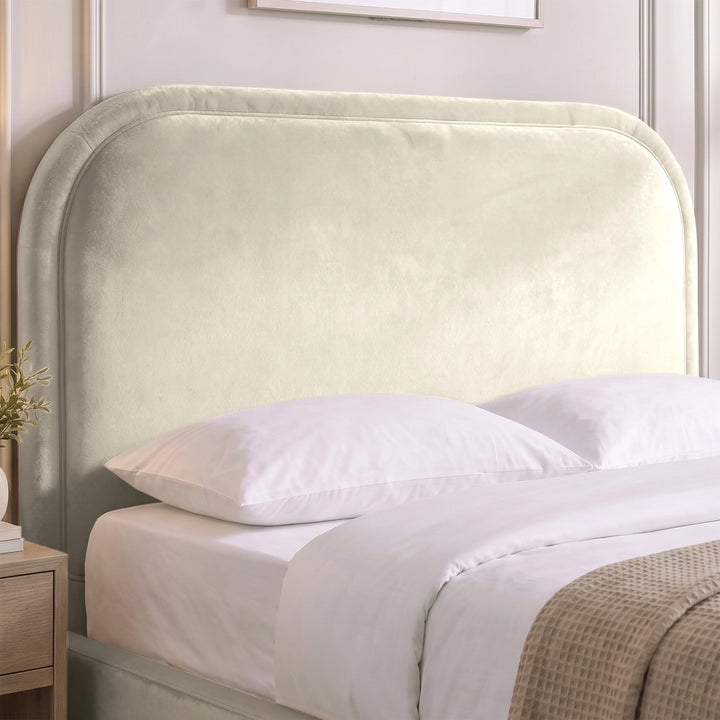 [Beige | King] Close-up of plush padded curved headboard with raised border piping that keeps its shape