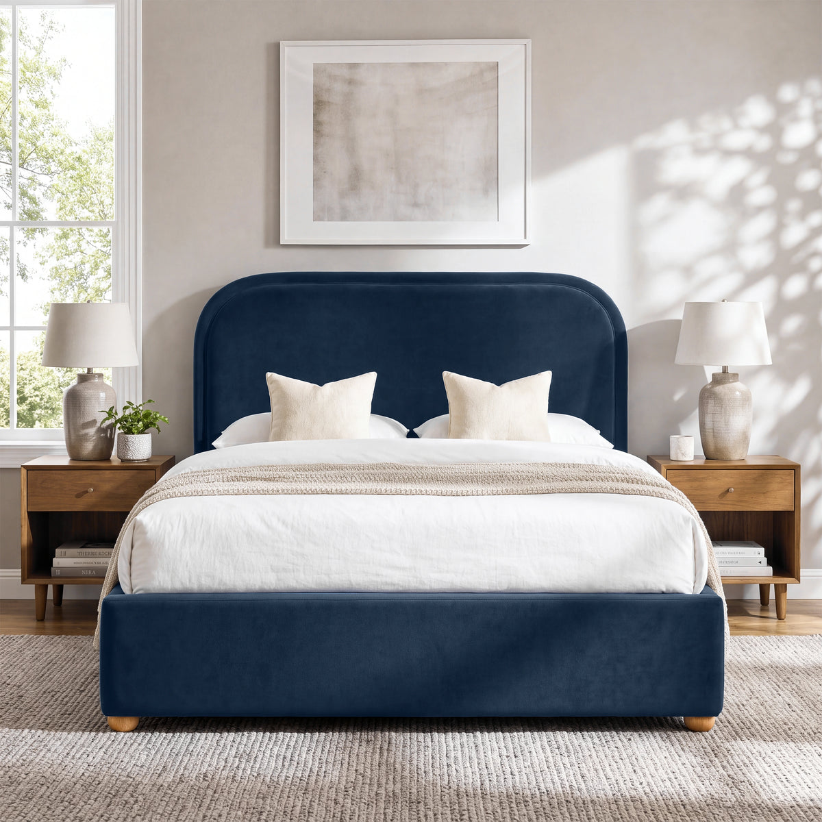 [Blue | King] Curved headboard ottoman bed in blue plush velvet, front bedroom view with rounded wooden feet