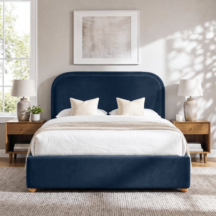 [Blue | King] Curved headboard ottoman bed in blue plush velvet, front bedroom view with rounded wooden feet