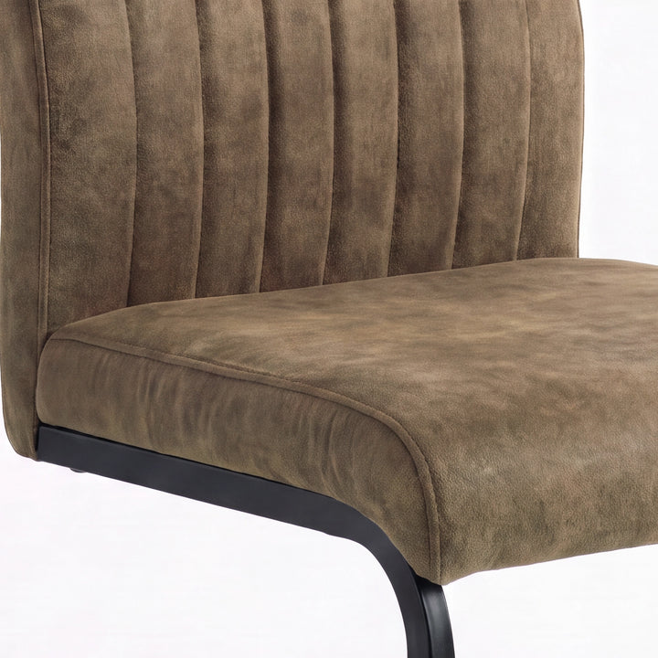 [Dark Brown] Close-up view of padded seat, piped edge, channelled back and black support metal frame.