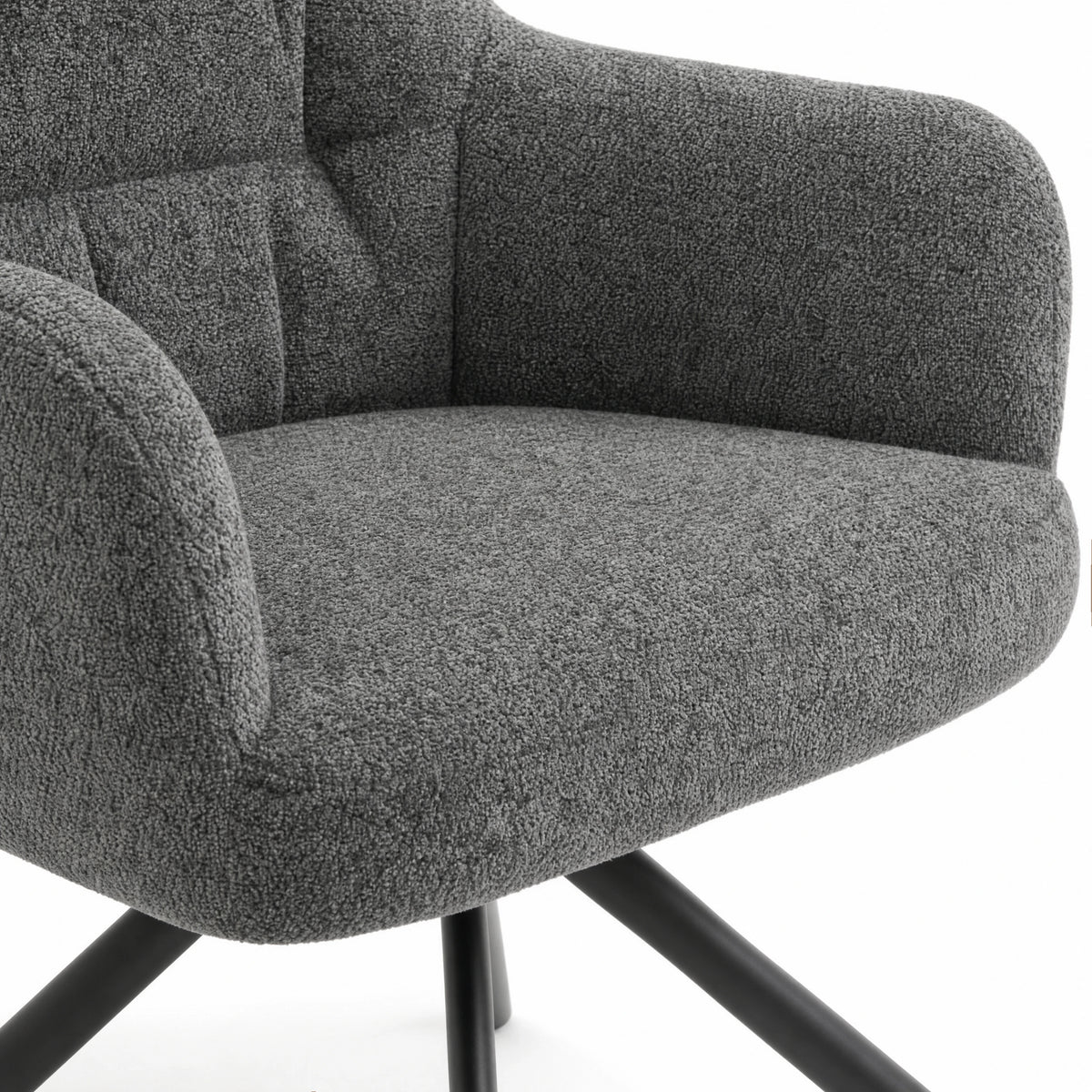 [Dark Grey | Set of 4] Dining chair close-up of boucle seat, curved arm and stitched padded back, with black legs partly visible.