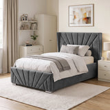 [Single | Dark Grey] upholstered bed frame with a tall channel-tufted sunrise headboard and matching footboard, shown in a styled bedroom