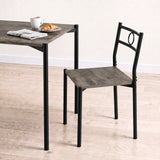[Dark Wood] Close-up showing the tabletop edge, chair seat, black round-pipe legs, circular chair back, mug and croissant