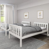 [White] split configuration of white double bunk bed forming two single beds against grey wall with white curtains