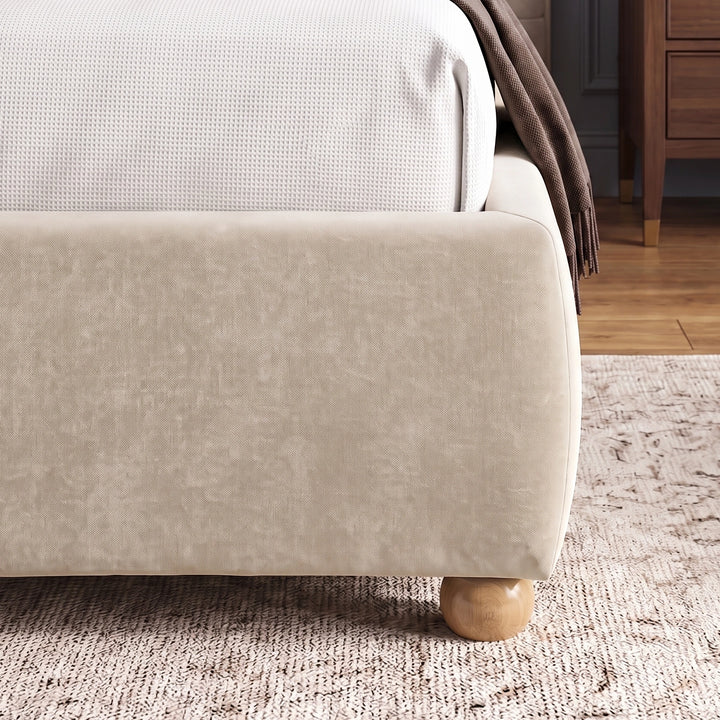 [Double | Beige] Corner side detail of beige bed frame emphasizing soft fabric texture of footboard and wooden legs