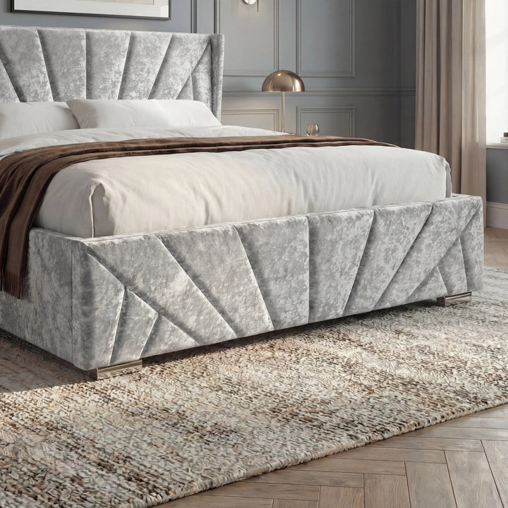 [Double | Silver] Footboard detail showing pleated velvet panels, white bedding, brown throw, and metal feet